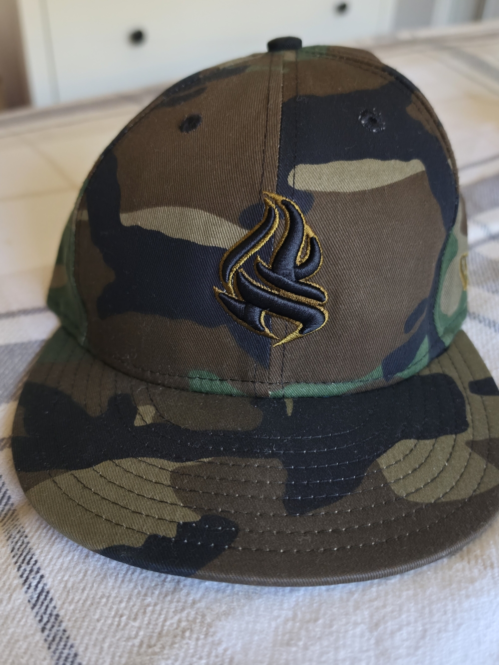 New Era Camo Snapback Hat with Black & Gold Embroidered Logo